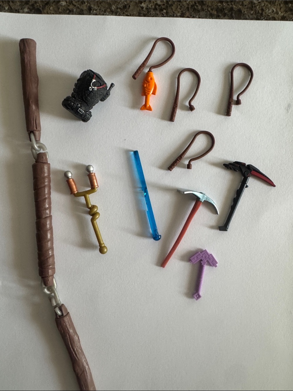 Assorted Action Figure Toy Accesories - 11 of Various sizes